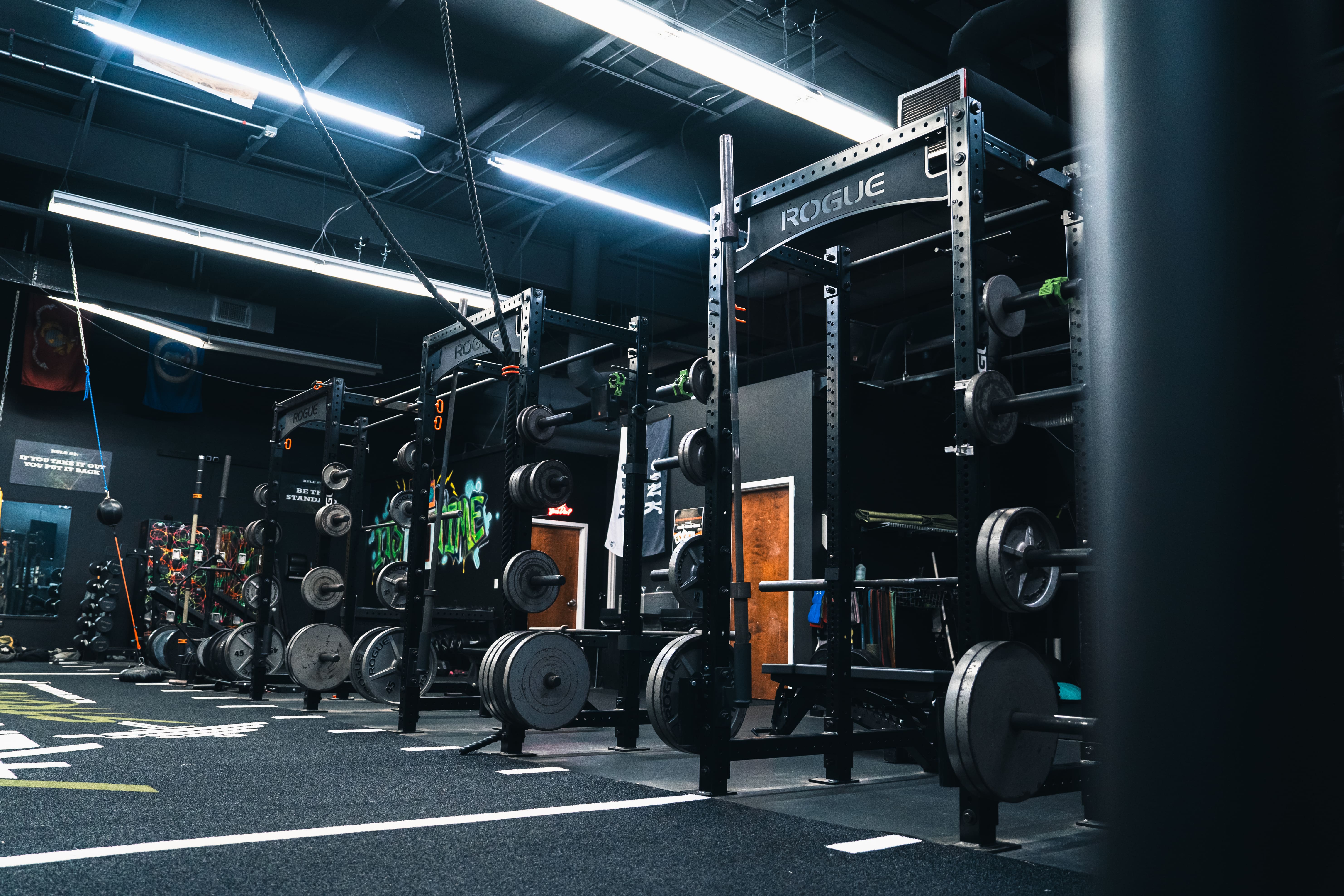 Squat racks and weight plates at Archetype Strength near NC State, Raleigh NC