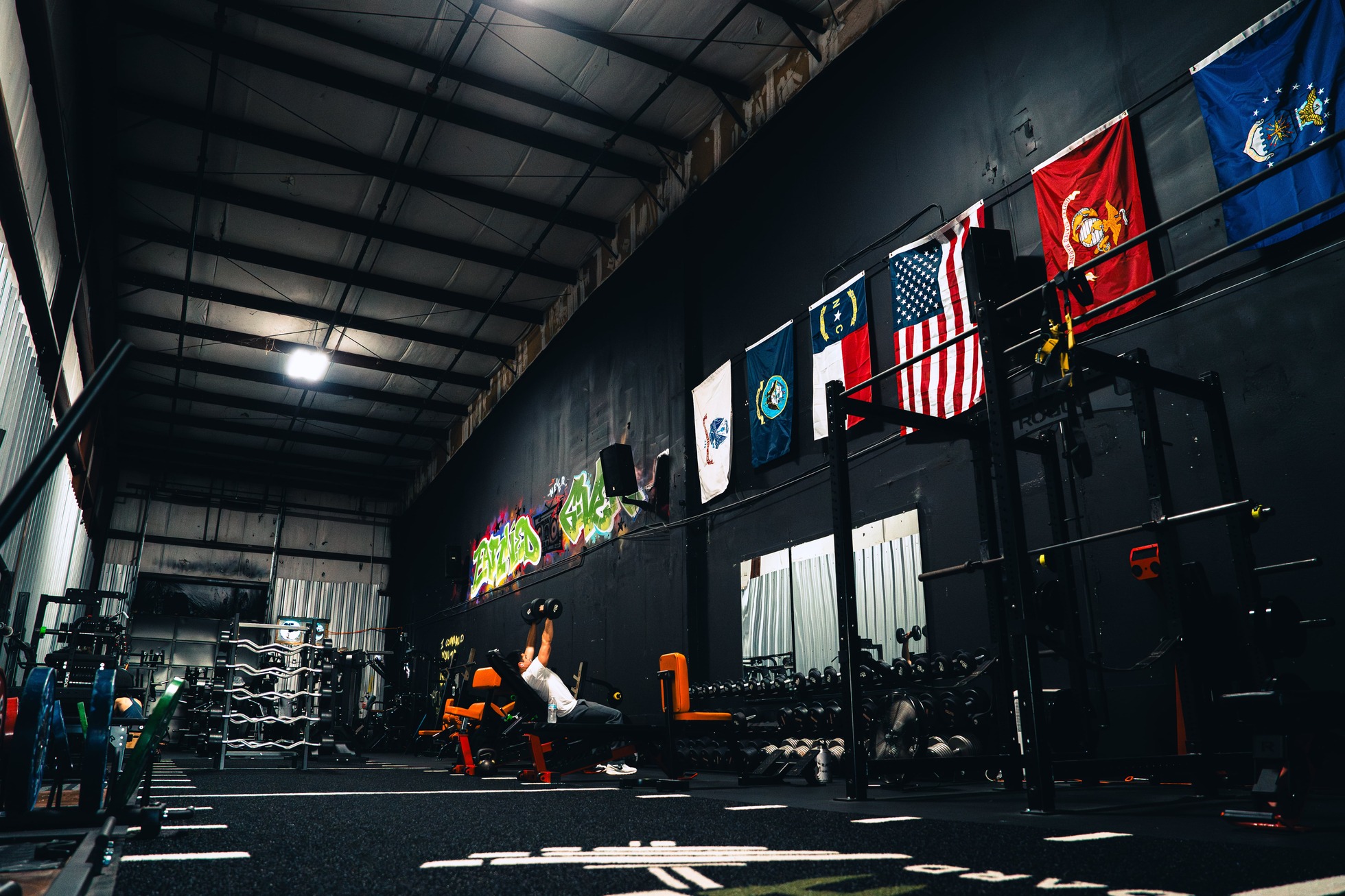 Dumbbells and machines at Archetype Strength gym in Raleigh NC